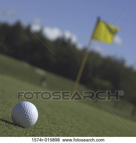 Close-up of a golf ball on a golf course View Large Photo Image Stock Photo - Close-up of a golf ball on a golf course. Fotosearch