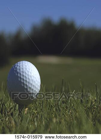 Close-up of a golf ball on a tee View Large Photo Image Stock Photo - Close-up of a golf ball on a tee. Fotosearch