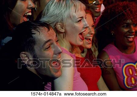 Stock Image - Close-up of a group of friends laughing together. Fotosearch
