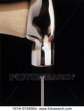 Close-up of a hammer hitting a nail View Large Photo Image Picture - Close-up of a hammer hitting a nail. Fotosearch