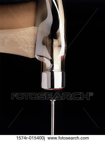 Close-up of a hammer hitting a nail View Large Photo Image Stock Image - Close-up of a hammer hitting a nail. Fotosearch