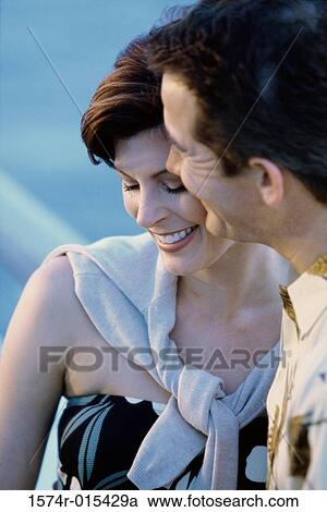 Stock Image - Close-up of a mature couple smiling. Fotosearch