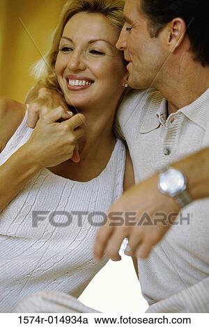 Close-up of a mid adult man romancing a mid adult woman View Large Photo Image Stock Image - Close-up of a mid adult man romancing a mid adult woman. Fotosearch