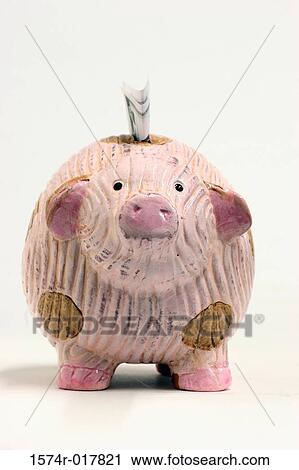 Close-up of a piggy bank with money in its slot View Large Photo Image Stock Image - Close-up of a piggy bank with money in its slot. Fotosearch