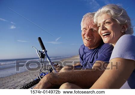 Close-up of a senior couple sitting on the beach View Large Photo Image Stock Image - Close-up of a senior couple sitting on the beach. Fotosearch