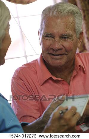 Close-up of a senior man looking at a senior woman View Large Photo Image Stock Image - Close-up of a senior man looking at a senior woman. Fotosearch