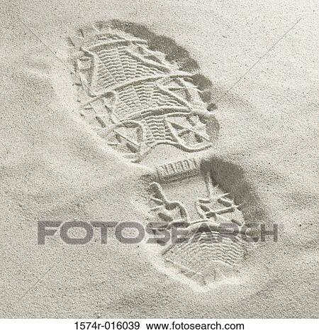 Close-up of a shoe print in the sand at the beach View Large Photo Image Stock Photo - Close-up of a shoe print in the sand at the beach. Fotosearch
