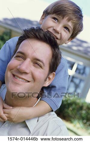 Close-up of a son hugging his father from behind View Large Photo Image Stock Image - Close-up of a son hugging his father from behind. Fotosearch