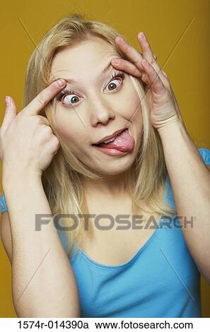 Close-up of a teenage girl making a face View Large Photo Image Stock Image - Close-up of a teenage girl making a face. Fotosearch