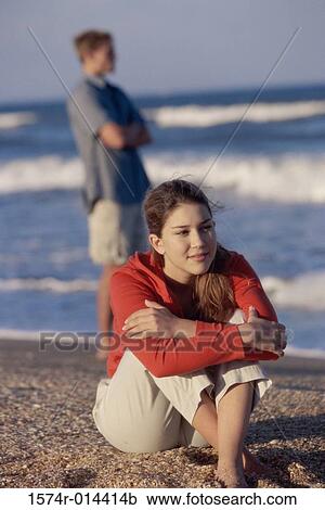 Close-up of a teenage girl sitting on the beach View Large Photo Image Stock Image - Close-up of a teenage girl sitting on the beach. Fotosearch
