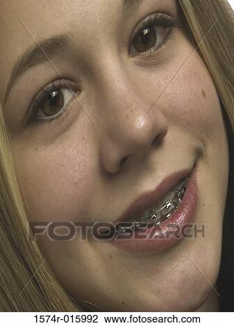 Close-up of a teenage girl smiling View Large Photo Image Stock Image - Close-up of a teenage girl smiling. Fotosearch