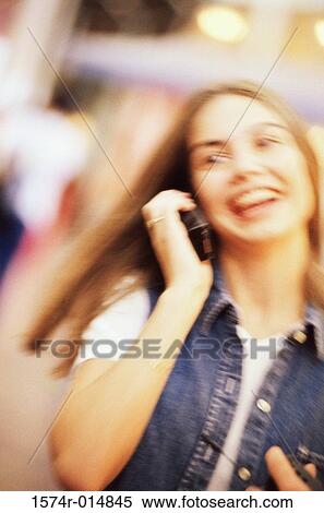 Stock Photography - Close-up of a teenage girl talking on a mobile phone. Fotosearch