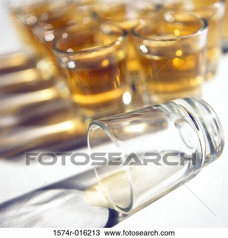 Close-up of a whisky spilt out of a glass View Large Photo Image Stock Image - Close-up of a whisky spilt out of a glass. Fotosearch