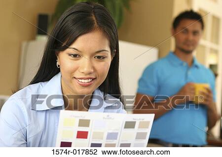 Close-up of a young woman choosing color from a color swatch View Large Photo Image Stock Image - Close-up of a young woman choosing color from a color swatch. Fotosearch