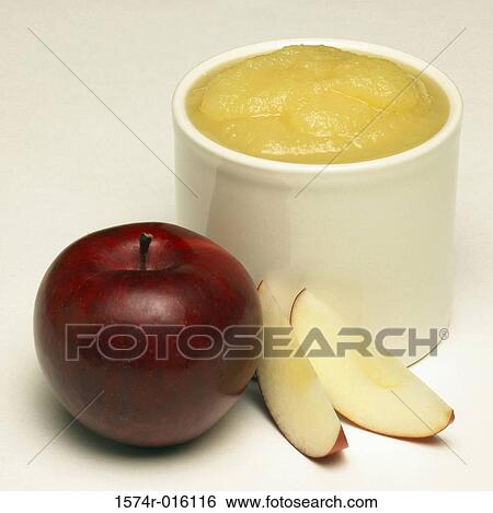 Close-up of an apple with apple sauce View Large Photo Image Stock Photograph - Close-up of an apple with apple sauce. Fotosearch