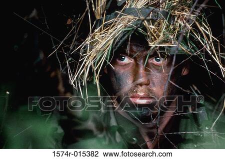 Close-up of an army soldier on a battlefield View Large Photo Image Stock Image - Close-up of an army soldier on a battlefield. Fotosearch