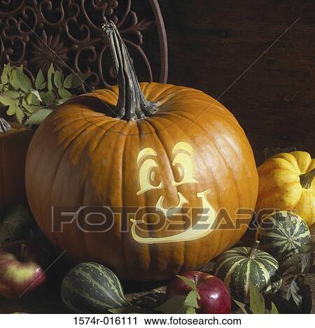 Close-up of an illuminated Jack-o'-Lantern with squash View Large Photo Image Stock Image - Close-up of an illuminated Jack-o'-Lantern with squash. Fotosearch