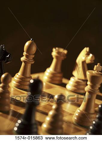 Close-up of chess pieces on chess board View Large Photo Image Stock Image - Close-up of chess pieces on chess board. Fotosearch