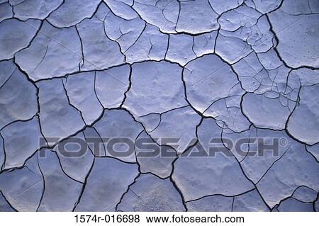 Close-up of dry cracked mud View Large Photo Image Stock Photo - Close-up of dry cracked mud. Fotosearch