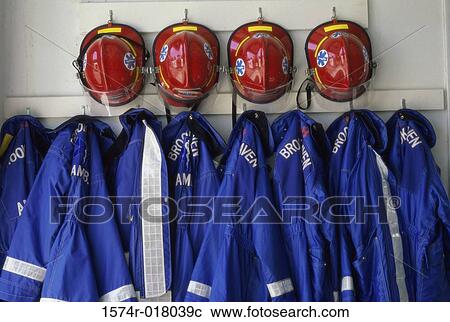 Close-up of fire fighter's helmet and fire protective suits hanging on hooks View Large Photo Image Stock Image - Close-up of fire fighter's helmet and fire protective suits hanging on hooks. Fotosearch