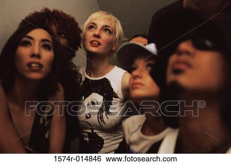 Close-up of four young women and a young man looking up View Large Photo Image Stock Photograph - Close-up of four young women and a young man looking up. Fotosearch