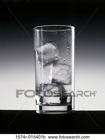 Stock Image - Close-up of ice cubes in a glass. Fotosearch