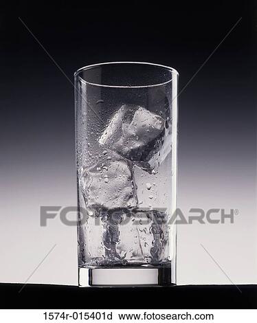 Stock Image - Close-up of ice cubes in a glass. Fotosearch