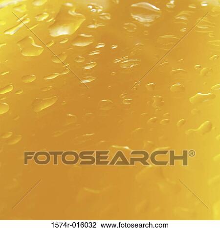 Close-up of orange juice in a glass View Large Photo Image Stock Image - Close-up of orange juice in a glass. Fotosearch