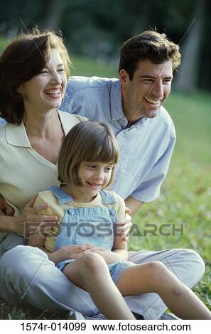 Close-up of parents with their daughter smiling View Large Photo Image Stock Photo - Close-up of parents with their daughter smiling. Fotosearch