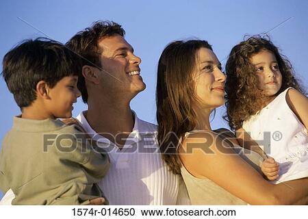 Close-up of parents with their son and daughter smiling View Large Photo Image Stock Image - Close-up of parents with their son and daughter smiling. Fotosearch