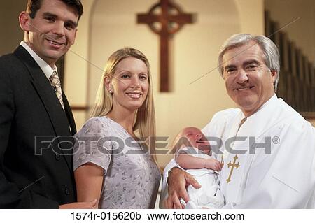 Close-up of parents with their son at a baptism View Large Photo Image Stock Image - Close-up of parents with their son at a baptism. Fotosearch