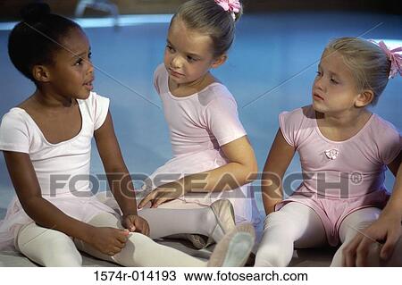 Close-up of three ballerinas sitting together View Large Photo Image Stock Image - Close-up of three ballerinas sitting together. Fotosearch