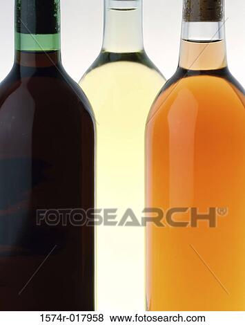 Stock Photo - Close-up of three wine bottles. Fotosearch