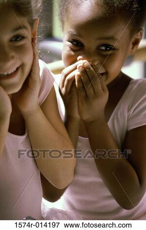 Close-up of two girls smiling View Large Photo Image Stock Photo - Close-up of two girls smiling. Fotosearch