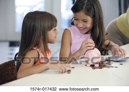Stock Image - Close-up of two sisters smiling. Fotosearch