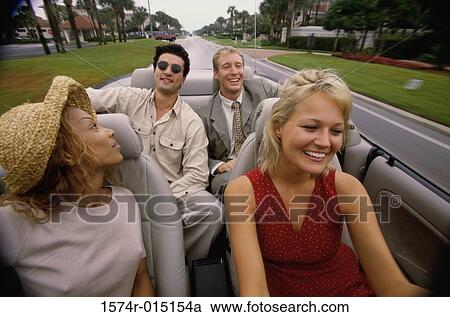 Close-up of two young couples sitting in a car View Large Photo Image Stock Image - Close-up of two young couples sitting in a car. Fotosearch