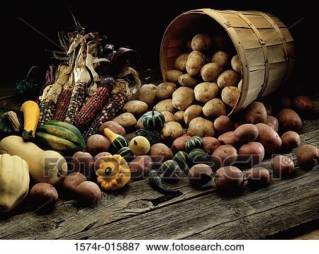 Stock Photo - Close-up of vegetables spilling from a basket. Fotosearch