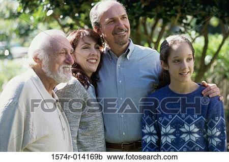 Family standing together smiling View Large Photo Image Stock Image - Family standing together smiling. Fotosearch