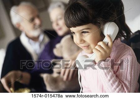 Girl talking on the telephone View Large Photo Image Stock Image - Girl talking on the telephone. Fotosearch