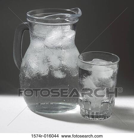 Glass and jug of ice water View Large Photo Image Picture - Glass and jug of ice water. Fotosearch