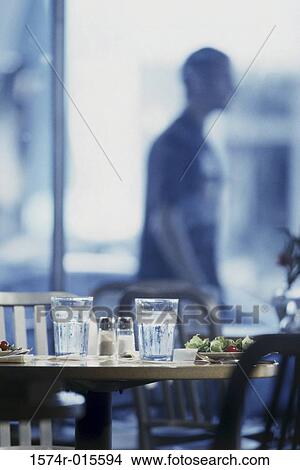 Picture - Glasses on a table in a restaurant. Fotosearch