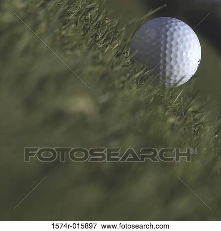 Stock Photo - Golf ball on the field. Fotosearch