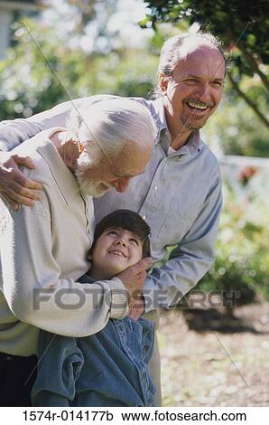 Grandfather hugging his granddaughter View Large Photo Image Stock Image - Grandfather hugging his granddaughter. Fotosearch