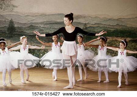 Group of ballet dancers dancing with their teacher View Large Photo Image Stock Photo - Group of ballet dancers dancing with their teacher. Fotosearch