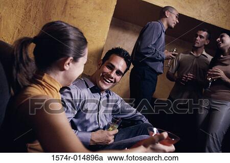 Stock Image - Group of people at a party. Fotosearch