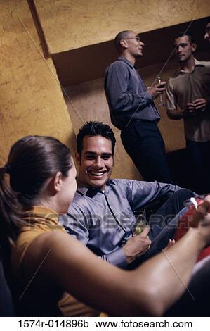 Stock Image - Group of people at a party. Fotosearch