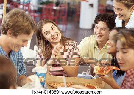 Group of teenagers smiling in a restaurant View Large Photo Image Stock Image - Group of teenagers smiling in a restaurant. Fotosearch