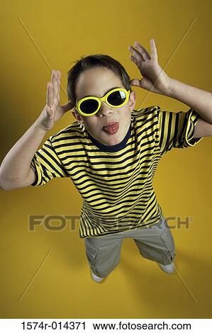 High angle view of a boy making a face View Large Photo Image Stock Image - High angle view of a boy making a face. Fotosearch