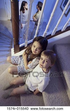 High angle view of a brother and sister sitting on stairs View Large Photo Image Stock Image - High angle view of a brother and sister sitting on stairs. Fotosearch