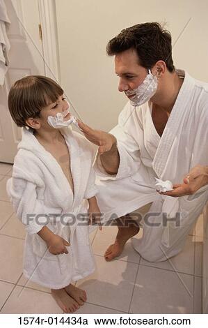 High angle view of a father applying shaving cream to his son's face View Large Photo Image Stock Image - High angle view of a father applying shaving cream to his son's face. Fotosearch